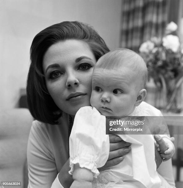 Joan Collins pictured with her four-month-old daughter Tara Newley. They have come home to London to see the family. Here they are today after mum...