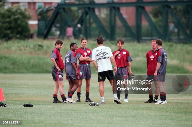 Manchester United in their first day of training. Assistant manager Brian Kidd talks to players left to right: Andrei Kanchelskis, Paul Parker, David...