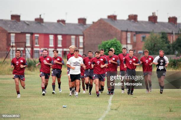 Manchester United in their first day of training. Left to right: Eric Cantona, Brian McClair, Gary Neville, Peter Schmeichel, Assistant manager Brian...
