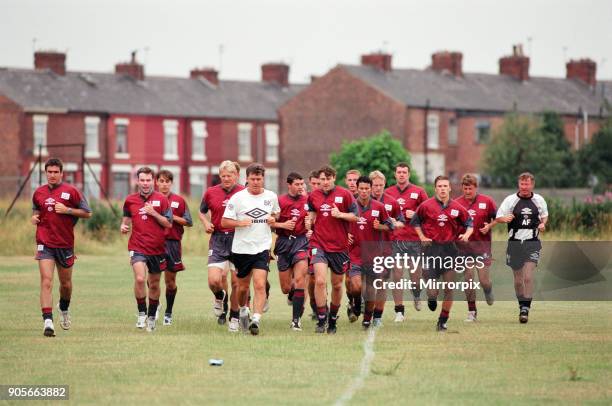 Manchester United in their first day of training. Left to right: Eric Cantona, Brian McClair, Gary Neville, Peter Schmeichel, Assistant manager Brian...