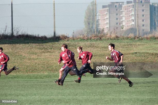 Manchester United in training. David Beckham running with Gary and Phil Neville 18th November 1996.