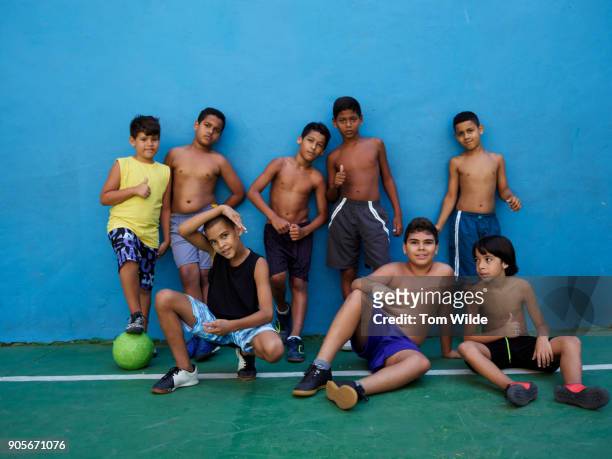 group of boys posing after a game of football - the project portraits stock pictures, royalty-free photos & images