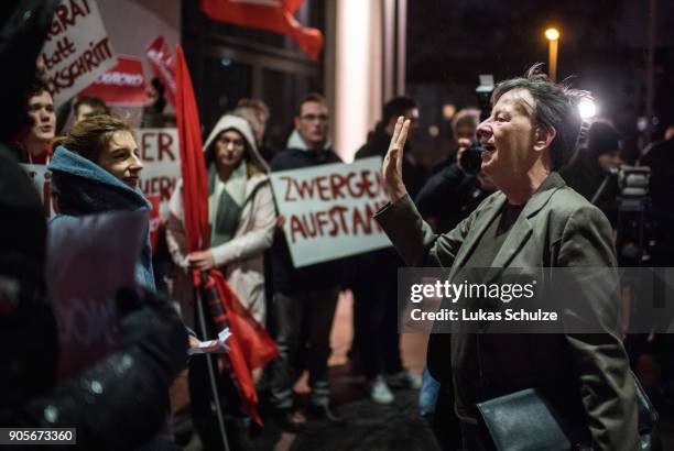 German Environment Minister Barbara Hendricks talks to young politicians as she arrives for exploratory talks to form a government on January 16,...