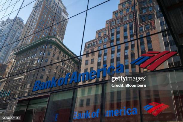 Building are seen reflected on the exterior of a Bank of America Corp. Branch in New York, U.S., on Monday, Jan. 15, 2018. Bank of America Corp. Is...