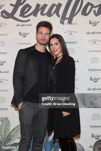 Sebastian Pannek and Kattia Vides attend the Lena Hoschek Fashion Show Berlin at Botanischer Garten on January 16, 2018 in Berlin, Germany.