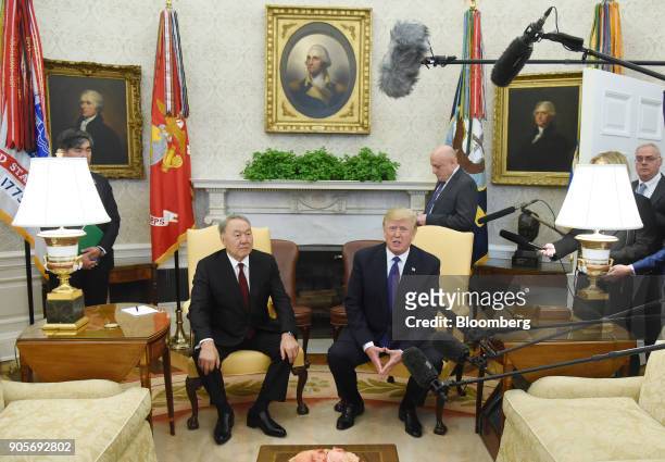 President Donald Trump, speaks while Nursultan Nazarbayev, Kazakhstan's president, left, listens during a meeting in the Oval Office of the White...
