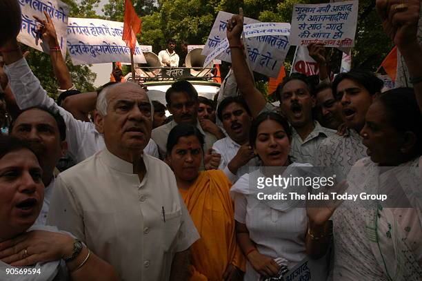 Uma Bharti, former Chief Minister of Madhya Pradesh and expelled BJP and Bharatiya Janshakti Party leader with Madan Lal Khurana, BJP leader and...