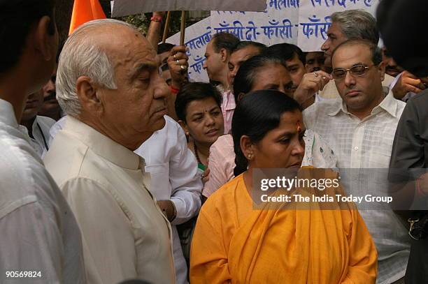 President of Bharatiya Jan Shakti, Uma Bharti and former Delhi chief minister Madan Lal Khurana courted arrest at the Parliament police station along...