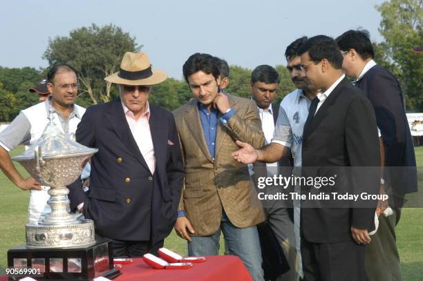 Bollywood actor Saif Ali Khan and father Mansoor Ali Khan Pataudi with others at the Deutsche Bank Bhopal-Pataudi Polo Trophy 2006, the curtain...