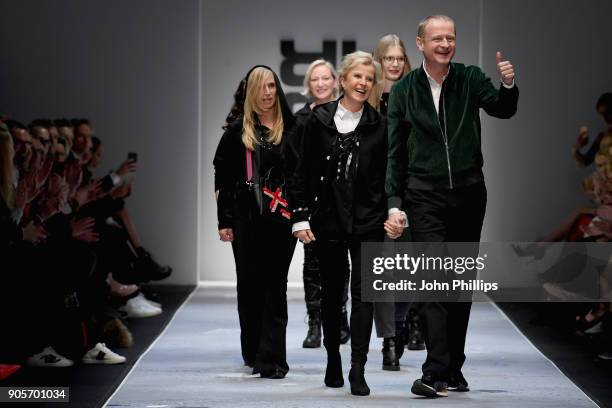 Designers Ulrich Schulte and Isi Degel aknowledge the applause of the guests at the end of the Riani show during the MBFW Berlin January 2018 at...