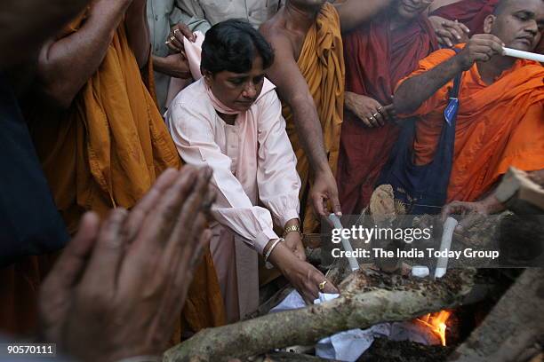 Bahujan Samaj Party supremo Mayawati lights the funeral pyre of Kanshi Ram, founder of BSP, in New Delhi, India, on Monday. Kanshi Ram passed away on...