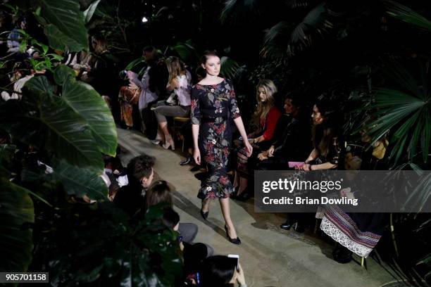 Model walks the runway during the Lena Hoschek Fashion Show Berlin at Botanischer Garten on January 16, 2018 in Berlin, Germany.