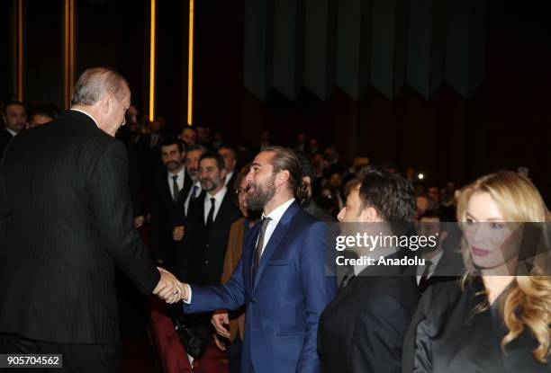 Turkish President Recep Tayyip Erdogan greets the Turkish actor Engin Altan Duzyatan during the premiere of the 'Kut'ul Amare' TV serie at Bestepe...