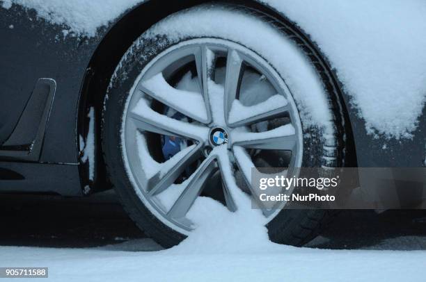 The wheel of a BMW car is seen covered in snow in Bydgoszcz, Poland on January 16, 2018. More snow is expected for the coming days across the country...