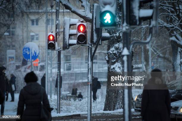 Street lights are seen covered with snow in Bydgoszcz, Poland on January 16, 2018. More snow is expected for the coming days across the country and...