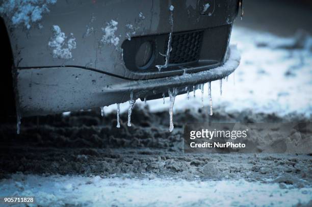 Icicles are seen hanging from a car bumper in Bydgoszcz, Poland on January 16, 2018. More snow is expected for the coming days across the country and...