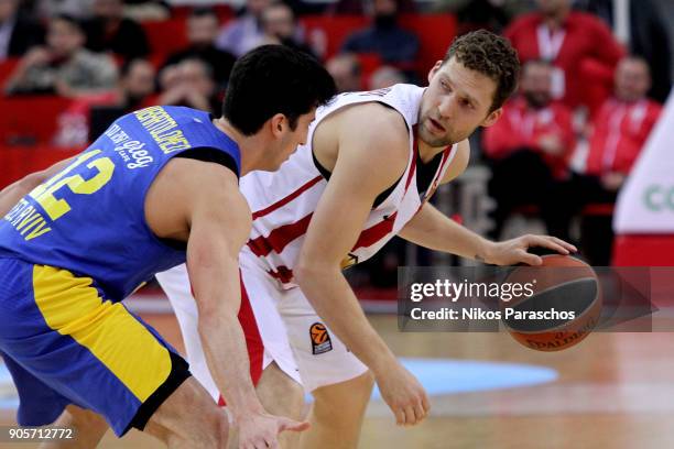 Janis Strelnieks, #13 of Olympiacos Piraeus competes with during the 2017/2018 Turkish Airlines EuroLeague Regular Season Round 18 game between...