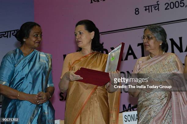 Sonia Gandhi, President of All India Congress Committee and United Progressive Alliance Chairperson along with Meira Kumar, Union Cabinet Minister...