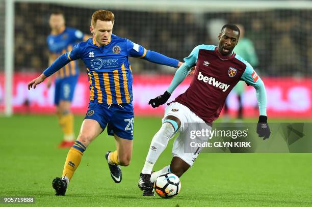 Shrewsbury Town's English midfielder Jon Nolan vies with West Ham United's Spanish midfielder Pedro Obiang during the FA Cup third round replay...