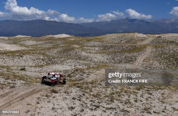 Toyota's driver Nasser Al-Attiyah of Qatar and his co-driver Mathieu Baumel of France compete during the Stage 10 of the Dakar 2018 between Salta and...