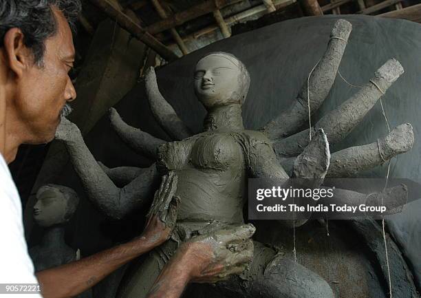 Artists making Durga idols in Kumartuli, Kolkata, West Bengal, India