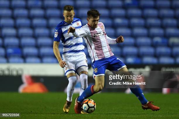 Danny Newton of Stevenage holds off Chris Gunter of Reading during The Emirates FA Cup Third Round Replay match between Reading and Stevenage at...