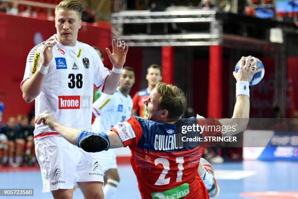 Norway's Magnus Gullerud shoots on goal during the Group B handball match of the Men's 2018 EHF European Handball Championship between Norway and...