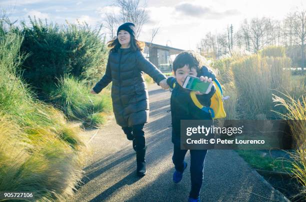 young boy leading the way - peter lourenco stock-fotos und bilder