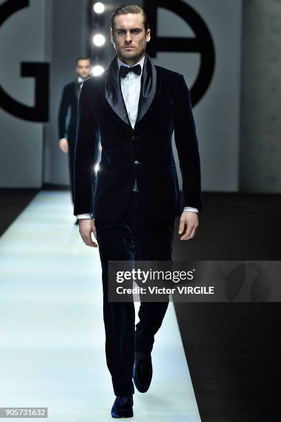 Model walks the runway at the Giorgio Armani show during Milan Men's Fashion Week Fall/Winter 2018/19 on January 15, 2018 in Milan, Italy.