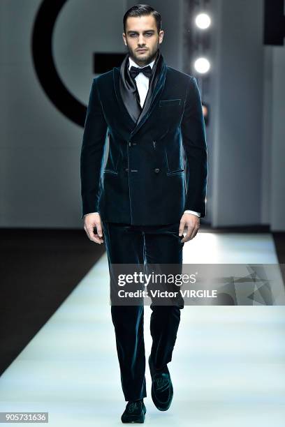 Model walks the runway at the Giorgio Armani show during Milan Men's Fashion Week Fall/Winter 2018/19 on January 15, 2018 in Milan, Italy.