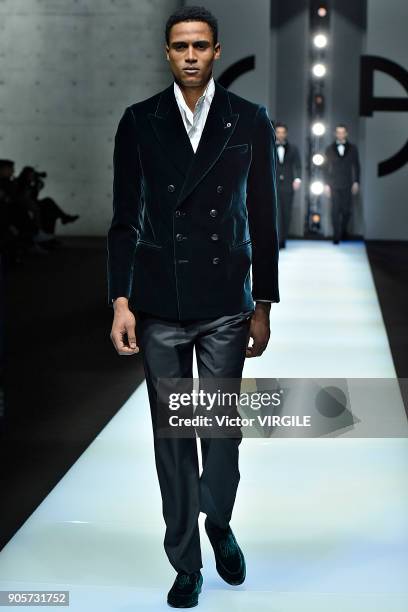 Model walks the runway at the Giorgio Armani show during Milan Men's Fashion Week Fall/Winter 2018/19 on January 15, 2018 in Milan, Italy.