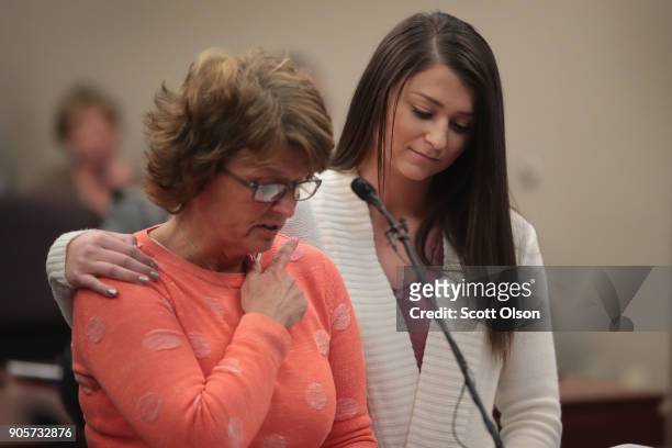 Lindsey Lemke comforts her mother Christy as she reads a victims impact statement on her daughter's behalf at the sentencing hearing of Larry Nassar...