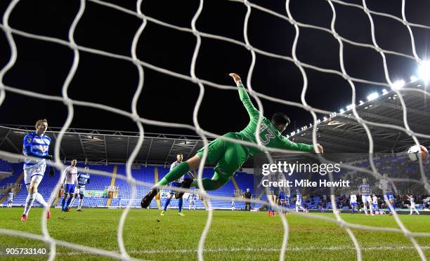 Jon Dadi Bodvarsson of Reading shoots past Tom King of Stevenage to score their first goal during The Emirates FA Cup Third Round Replay match...