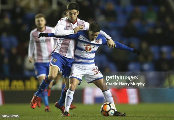 Tom Pett of Stevenage and Liam Kelly of Reading vie for the ball during the Emirates FA Cup Third Round Replay match between Reading and Stevenage at...