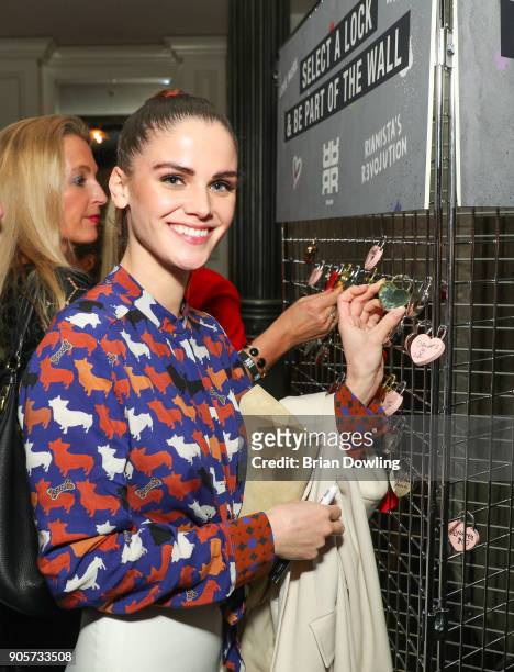 Lisa Tomaschewsky locks her Love Lock attends the Riani After Show Party during the MBFW Berlin January 2018 at Grace Restaurant on January 16, 2018...