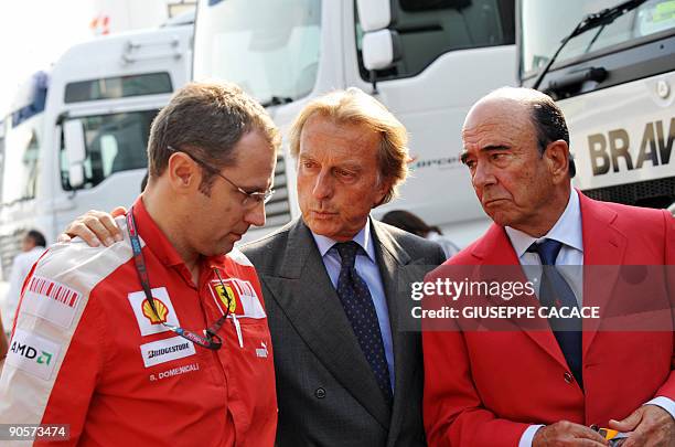 Ferrari's team principal Stefano Domenicali, Ferrari President Luca di Montezemolo, and the President of the Bank of Santander Emilio Botin walks in...