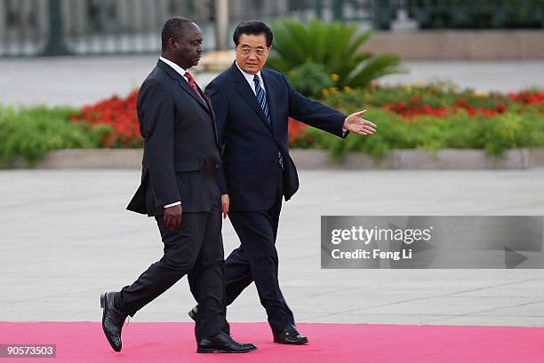 Chinese President Hu Jintao accompanies President of Central African Republic Francois Bozize Yangouvonda to view a guard of honour during a...