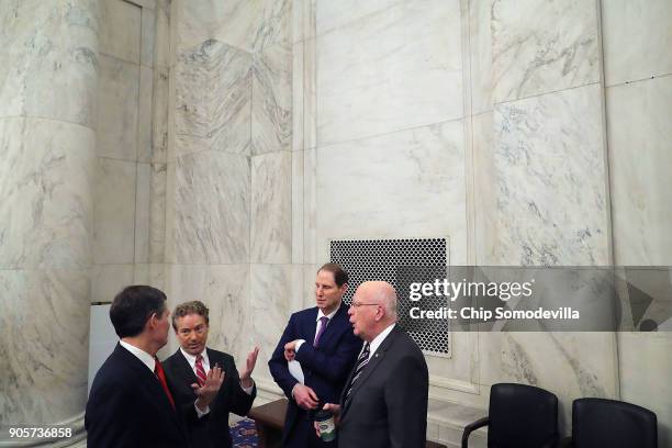 Sen. Steve Daines , Sen. Rand Paul , Sen. Ron Wyden and Sen. Patrick Leahy talk strategy before a news conference about their proposed reforms to the...