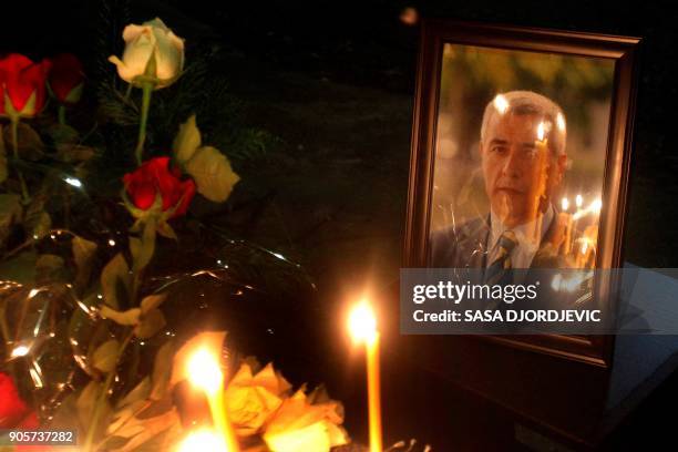 Candles have been litten on the spot where leading Kosovo Serb politician Oliver Ivanovic was killed in a brazen drive-by shooting in Mitrovica on...