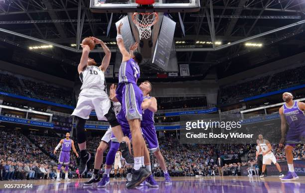 Matt Costello of the San Antonio Spurs shoots against Skal Labissiere of the Sacramento Kings on January 8, 2018 at Golden 1 Center in Sacramento,...