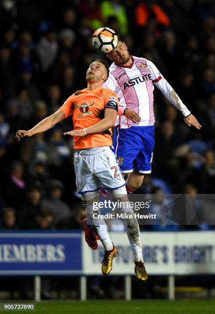 Ben Kennedy of Stevenage outjumps Chris Gunter of Reading during The Emirates FA Cup Third Round Replay match between Reading and Stevenage at...