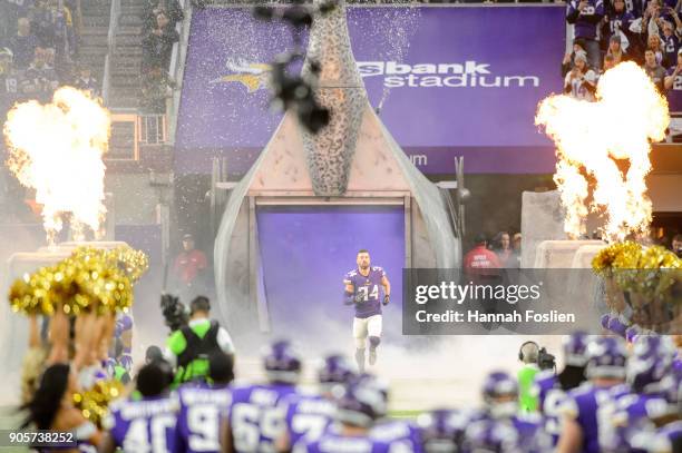 Andrew Sendejo of the Minnesota Vikings runs onto the field during player introductions before the NFC Divisional Playoff game against the New...