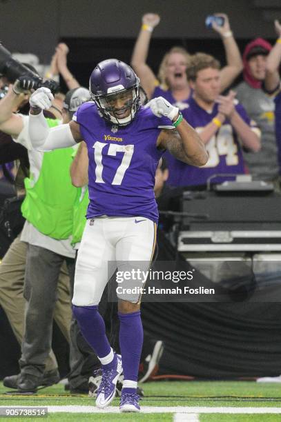 Jarius Wright of the Minnesota Vikings celebrates a play against the New Orleans Saints during the first half of the NFC Divisional Playoff game on...