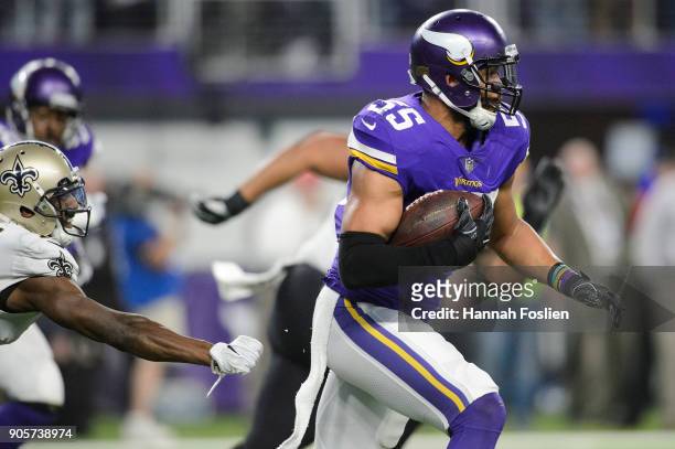 Anthony Barr of the Minnesota Vikings carries the ball after intercepting the ball during the first half of the NFC Divisional Playoff game on...