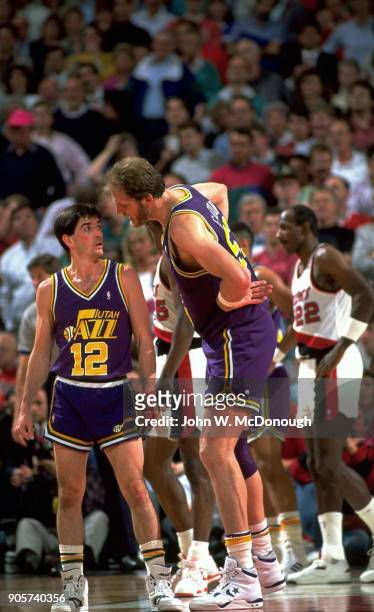 Playoffs: Utah Jazz Mark Eaton in pain on court with John Stockton during game vs Portland Trail Blazers at Memorial Coliseum. Game 2. Portland, OR...