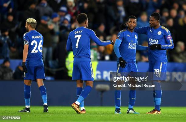 Kelechi Iheanacho of Leicester City celebrates as he scores their second goal with team mates after it was awarded following a VAR decision during...