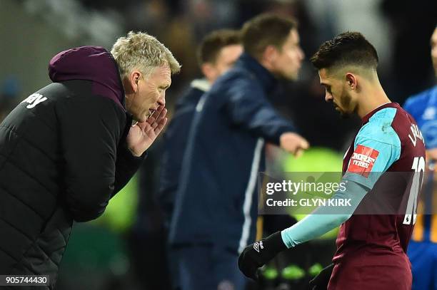 West Ham United's Scottish manager David Moyes gives advice to West Ham United's Argentinian midfielder Manuel Lanzini during the FA Cup third round...