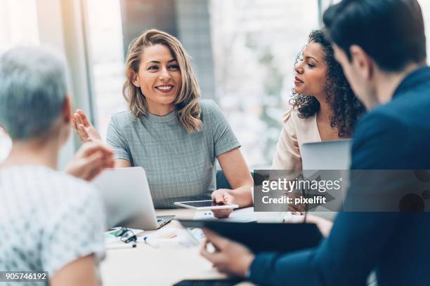 group of business persons in discussion - small group of people stock pictures, royalty-free photos & images