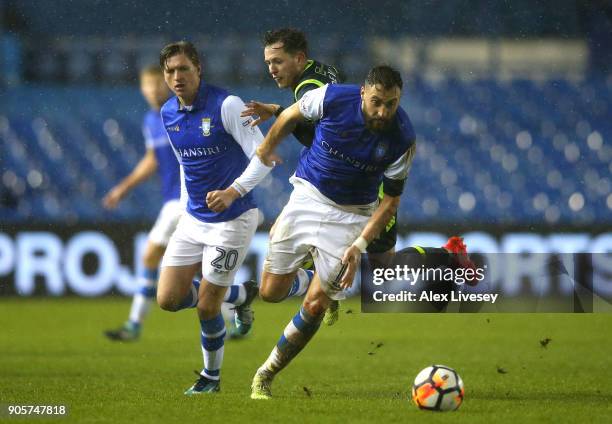 Atdhe Nuhiu of Sheffield Wednesday evades Jamie Devitt of Carlisle United during The Emirates FA Cup Third Round Replay match between Sheffield...