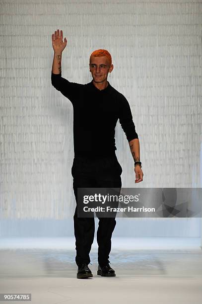 Designer David Delfin greets the crowd after the Davidelfin Spring 2010 Fashion Show at the Promenade during Mercedes-Benz Fashion Week at Bryant...